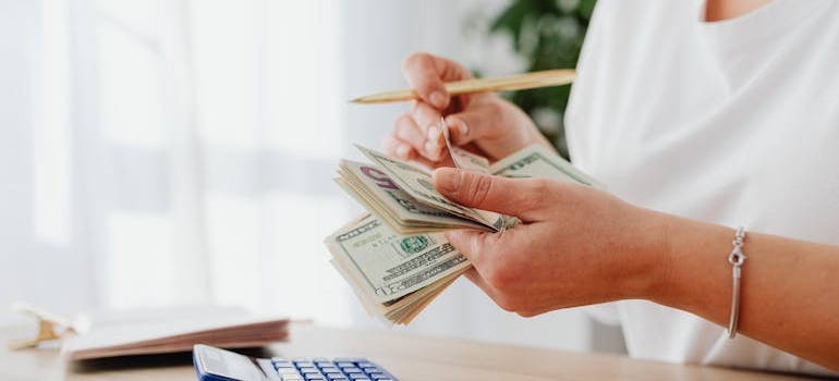 a person budgeting before choosing the right company for your office move