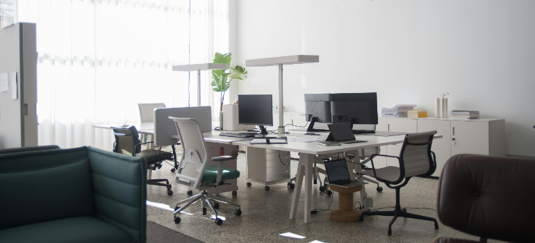 an office with desks and chairs