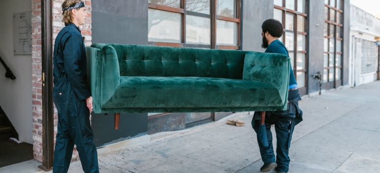 movers carrying a sofa