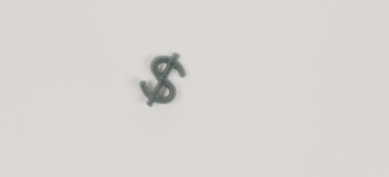 Dollar sign on a white surface