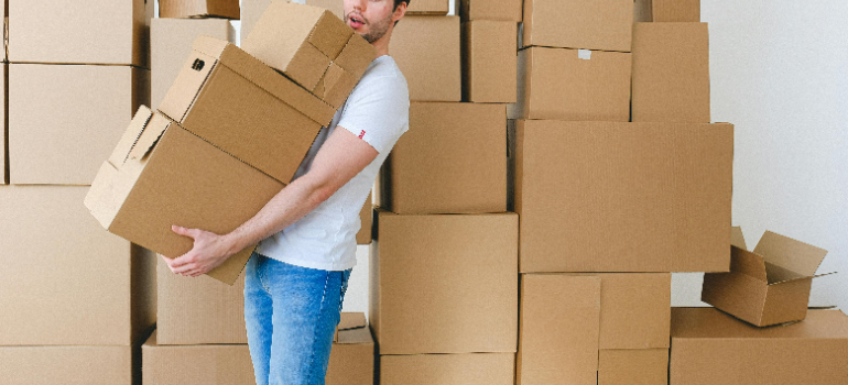 a man holding boxes 