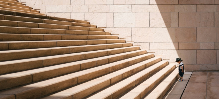 Child in front of stairs 