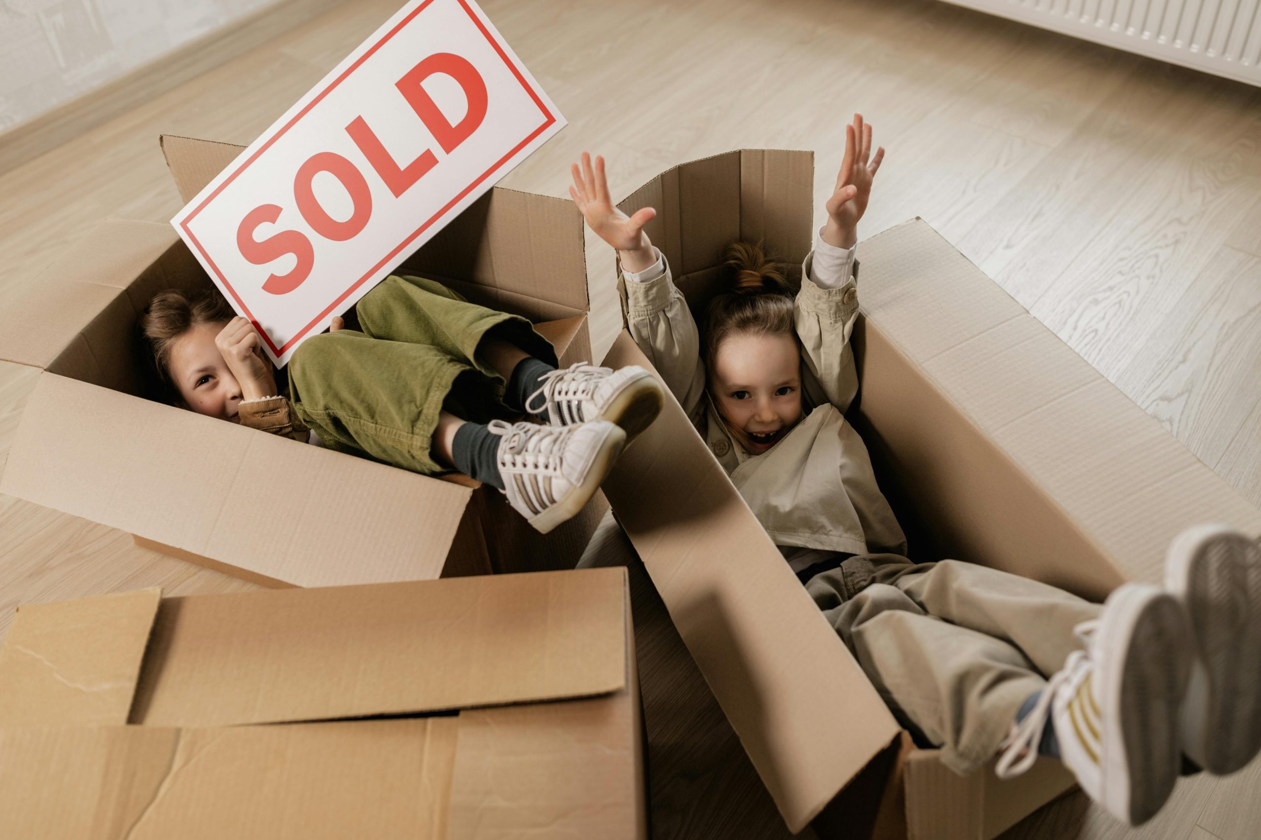 Children playing in boxes.