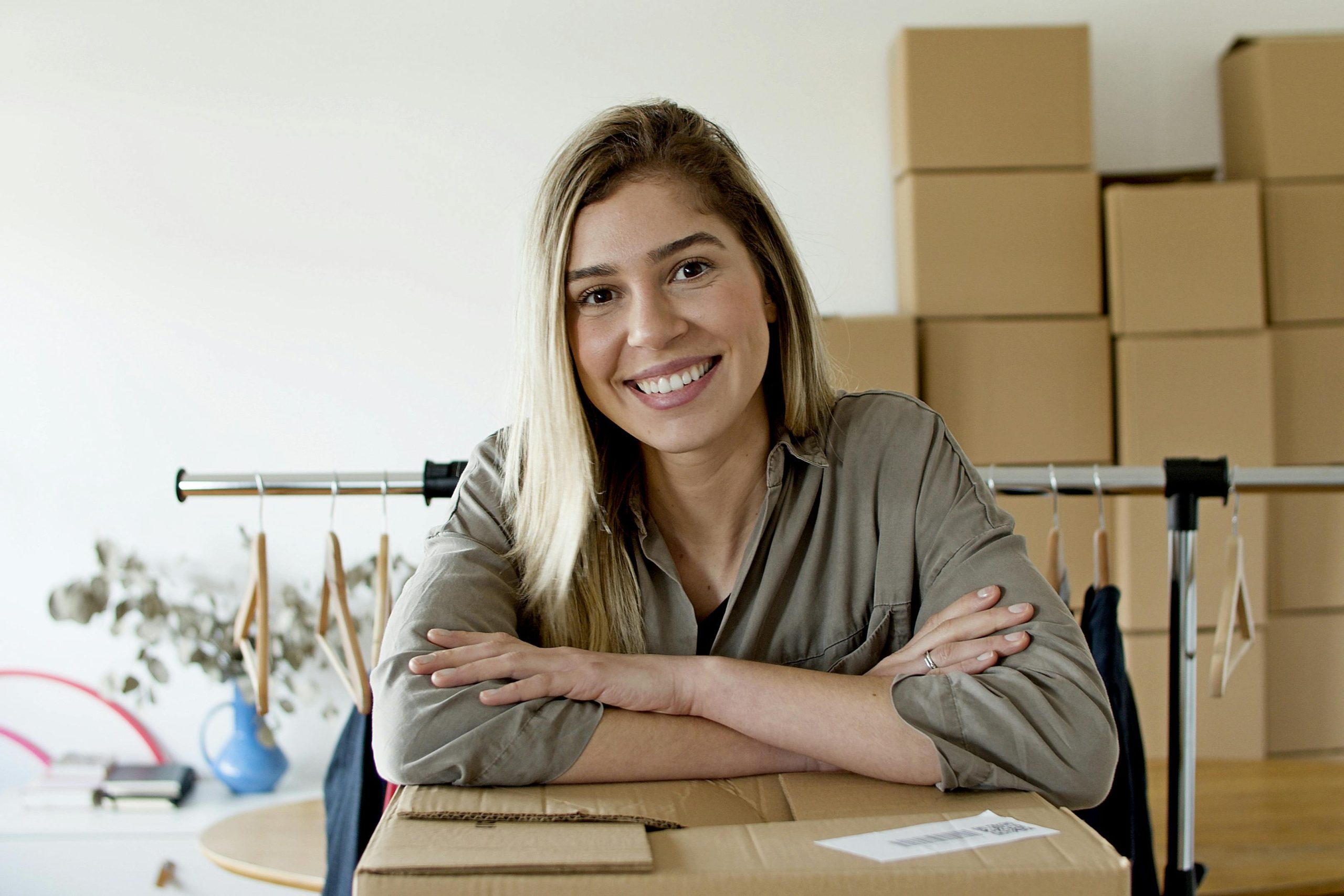 A girl smilig before moving for the first time.