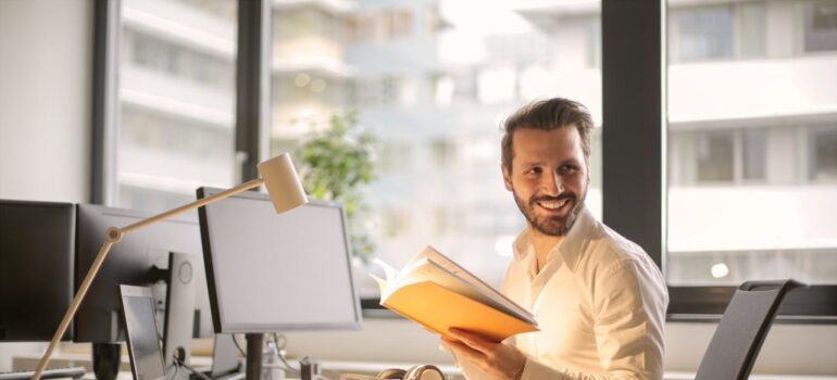 Photo of Man Holding a Book