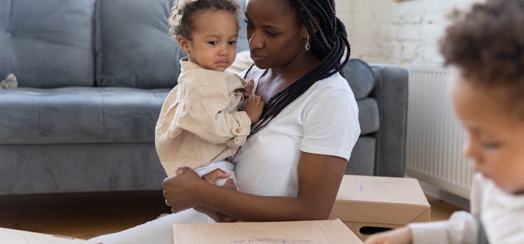 a woman holding a toddler 