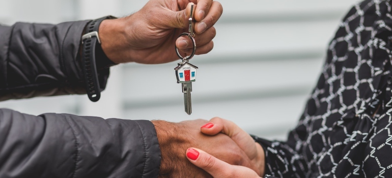 a man handling the keys to a woman