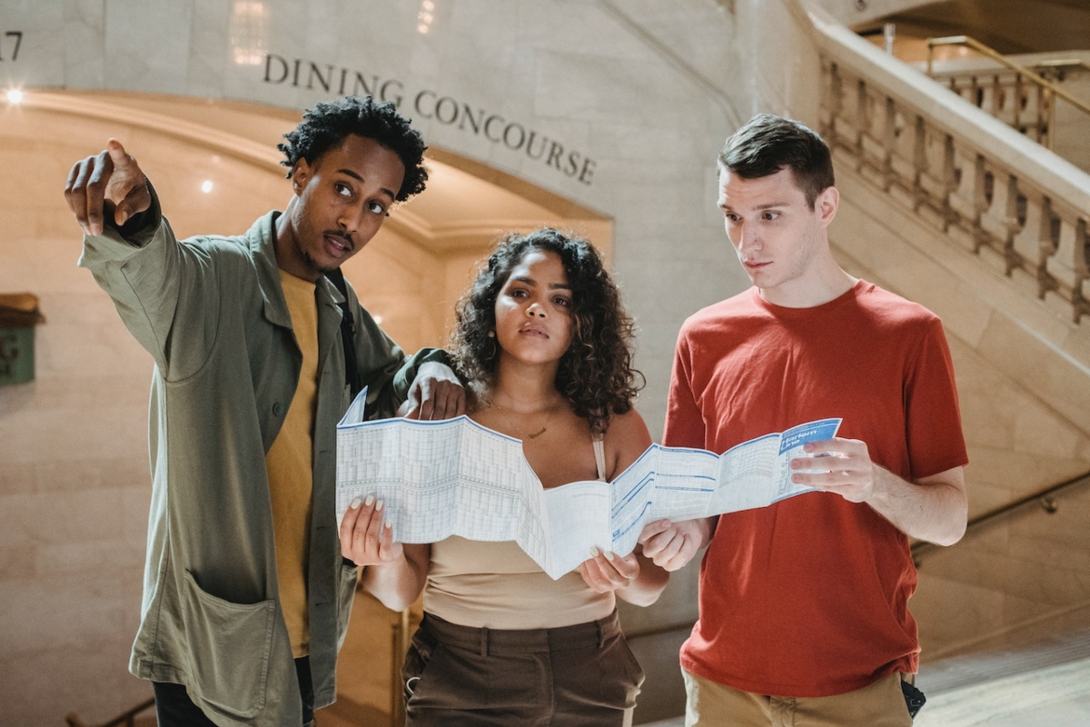 young people looking at a map