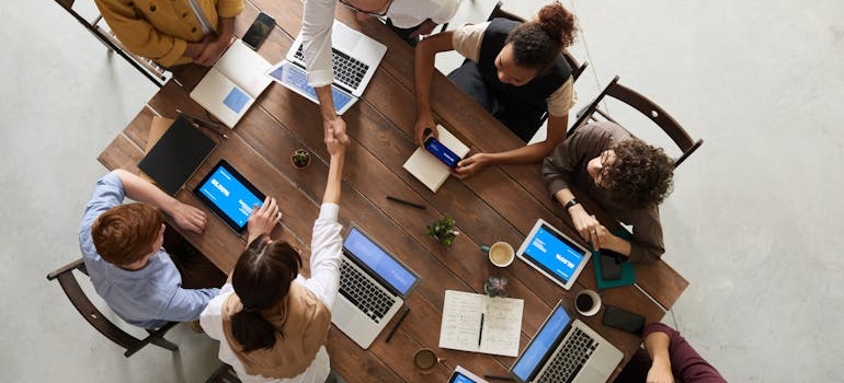 people at a meeting discussing about moving your business to Georgia 
