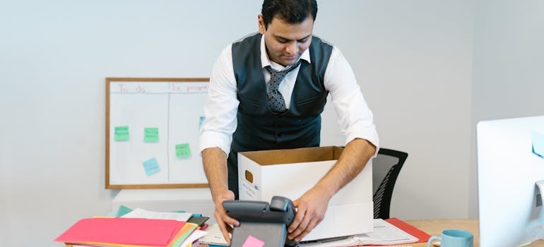 a man packing his office desk