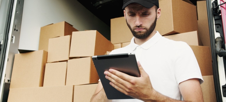 a professional mover checking the packing list
