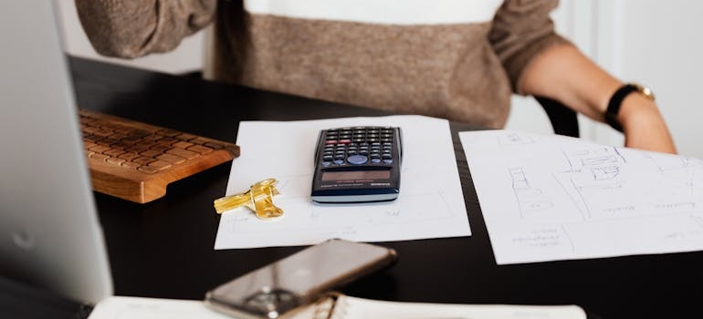 a person calculating the cost of moving to Sandy Springs