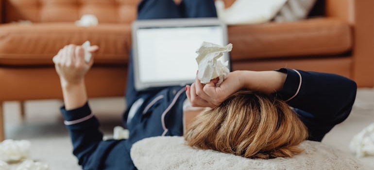 a woman  sneezing and experiencing allergy triggers in Georgia