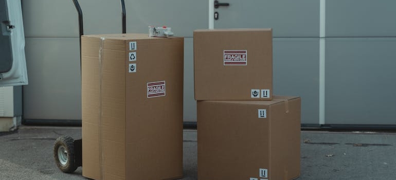 a dolly and boxes labelled 'fragile'