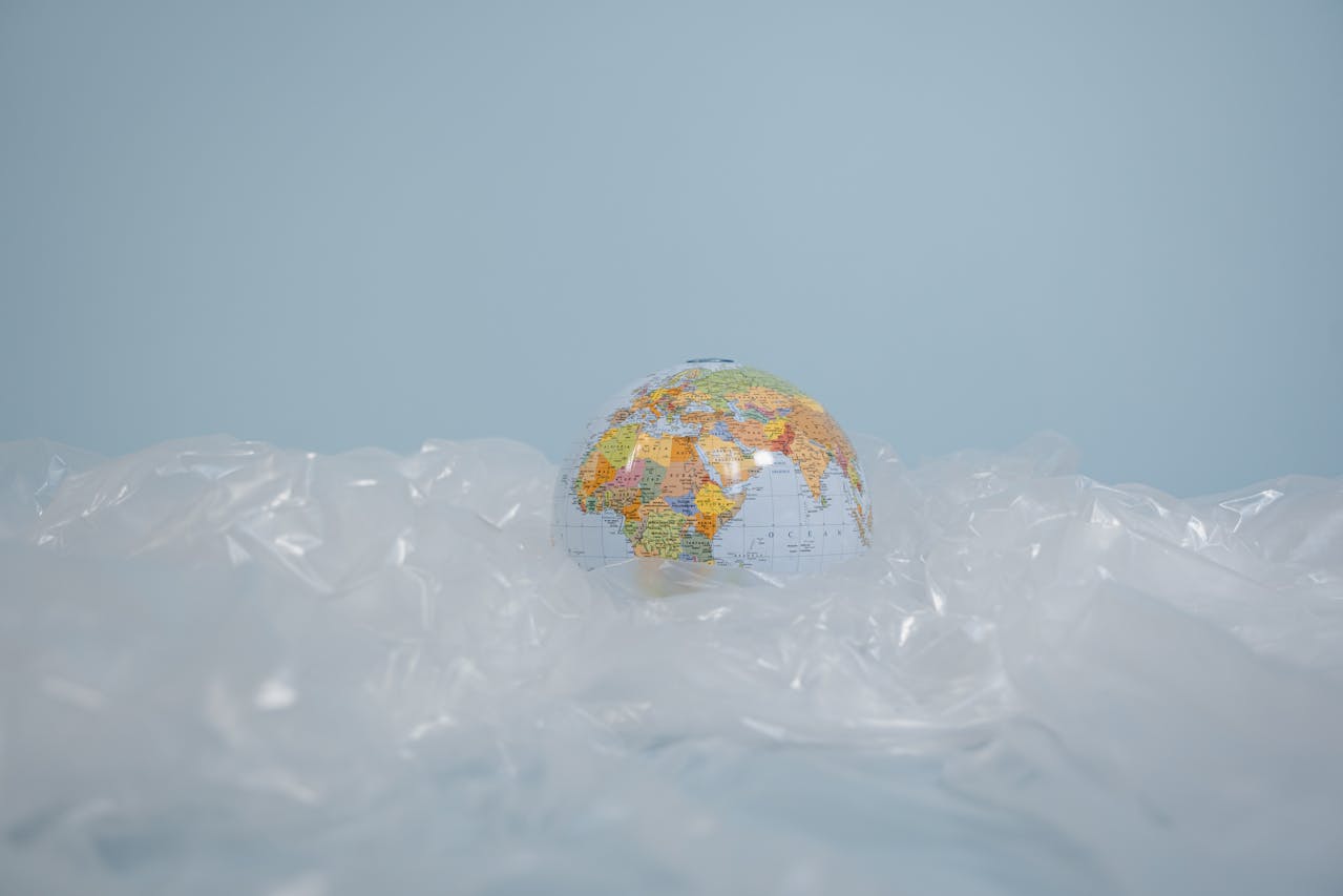 a globe surrounded by plastic wrap