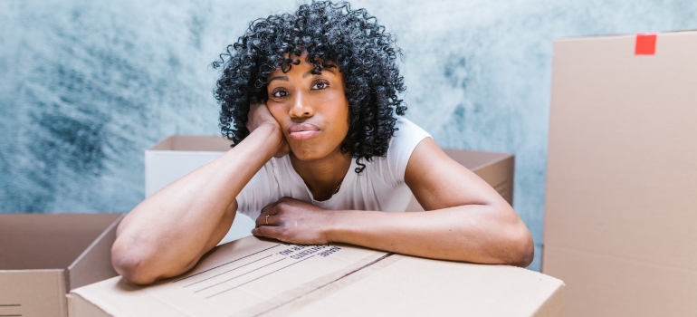 a worried woman moving out last minute