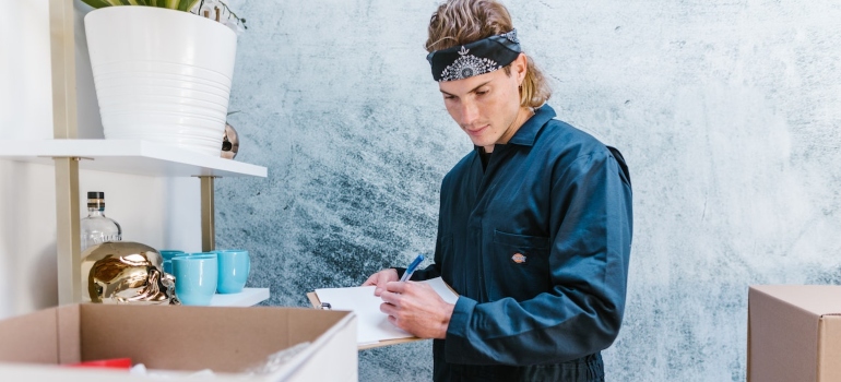 a mover checking the inventory list