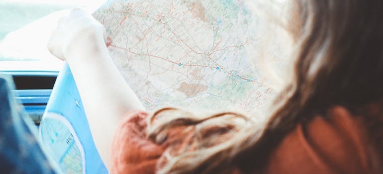 a girl holding  a map