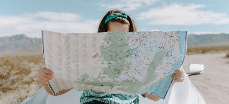 a woman looking at a map, searching for the best place in Atlanta