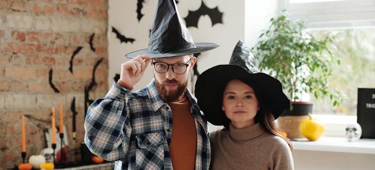 two people with Halloween hats talking about last-minute Halloween ideas