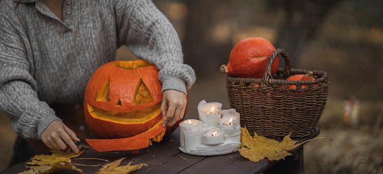 a person carving a pumpkin for halloween 