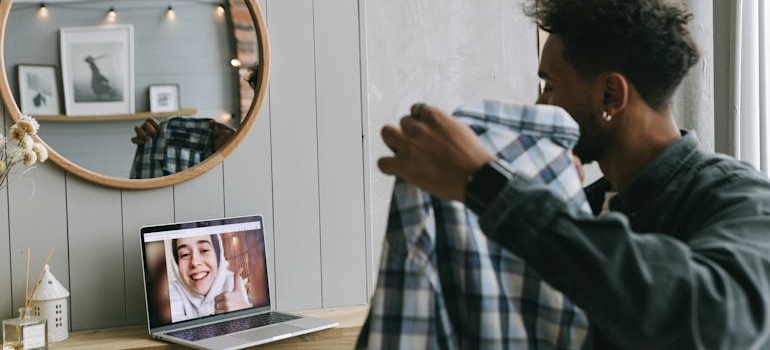 a person showing a shirt to a friend online